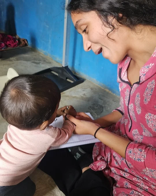 Maya Harpavat working with local families in India, Summer 2025.